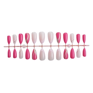 French almond press-on nails in pink and rose tones with elegant gold wire accents