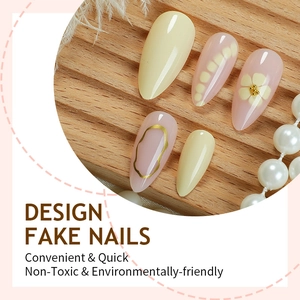Minimalist almond press on nails with 3D flower art and gold line accents in cream and pink