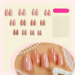 French nude almond press-on nails set with floral patterns and gold line accents
