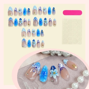 3D floral seashell press-on nails set with blue beach theme and almond shape design