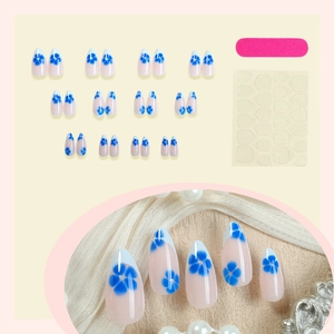 Blue floral French almond press-on nails set with rhinestones and full manicure kit
