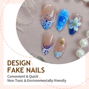 3D floral seashell press-on nails in sky blue and nude with pearl and rhinestone accents