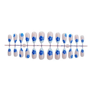 Blue floral almond press-on nails with 24 pieces in a nude pink base and diamond accents