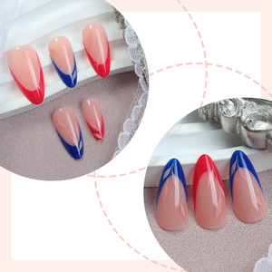 Almond-shaped French press-on nails with red and blue tips and white leaf patterns