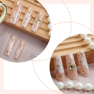 French gradient long press-on nails with heart gems and golden star charms