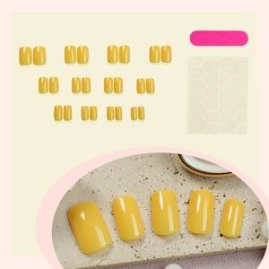 Glossy vibrant yellow press-on nails set with manicure tools for women in medium-long length