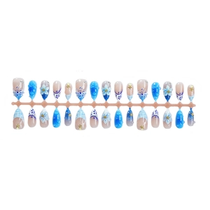 3D ocean-themed press-on nails with blue flowers, shells, and starfish textures