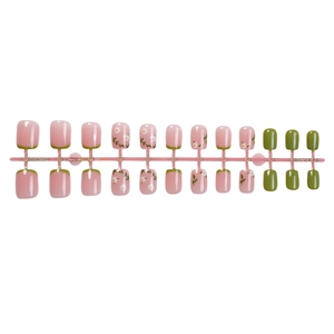 Pink and green press-on nail set with white daisy floral design and French tips