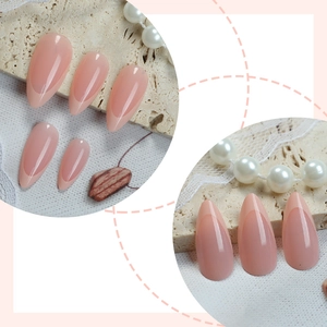 Elegant almond shaped press-on nails with nude pink base and soft French tips design