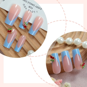 French blue and pink press-on nails with 3D cherry metal charms and pearls