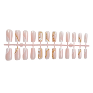 French press-on nails with pink base, gold 3D lines and white flower decorations