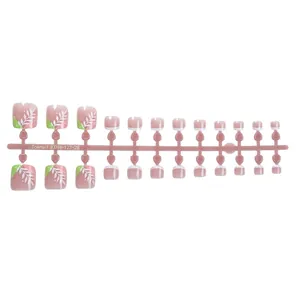 Floral short press-on toenails with pink base and white leaf patterns in minimalist style