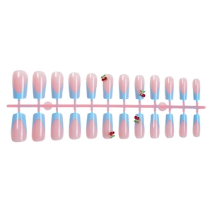 French tip press-on nails with 3D cherry charms and pink-blue gradient design