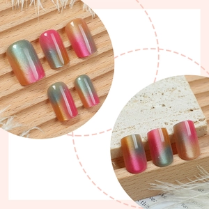 Cat eye press-on nails with cat-eye gradient effect and high gloss finish on marble base