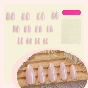 Almond shaped nude pink marble press-on nails set with silver heart details