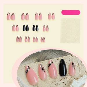 Pink almond press-on nails with black gold leaf patterns and 24pc manicure kit
