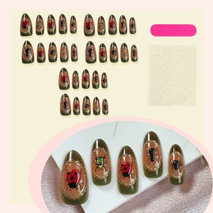 Almond insect theme press-on nail kit with ladybug patterns and glitter finish