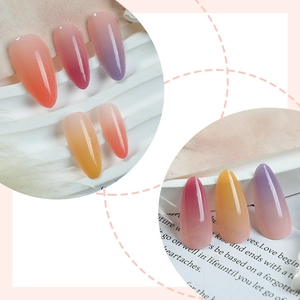 Glossy gradient almond press-on nails in sunset orange and purple shades