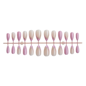 Nude and pink gradient press-on nails with gold glitter accents and linear designs