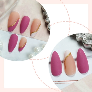 French almond press-on nails with pink matte finish and gold glitter wavy lines