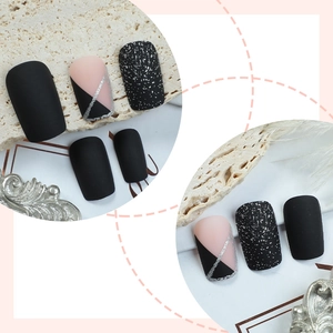 Short square matte black and pink press-on nails with silver glitter and geometric design