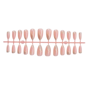 French almond press-on nails with white patterns and gold glitter outlines on 24pc set