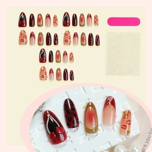 Handmade leopard print press-on nails with 3D cherry relief and burgundy almond shape