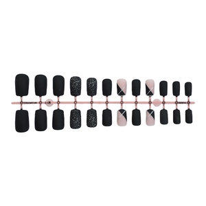 Short French style press-on nails set with black matte finish and glitter accents