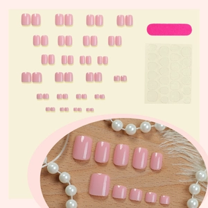 Pale pink solid color press-on toe nails set with file and adhesive tabs