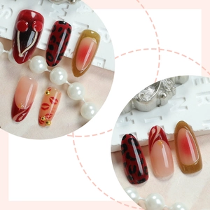 Handmade leopard almond press-on nails with 3D cherry and red french manicure designs