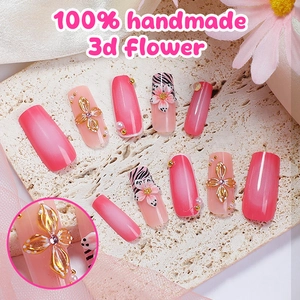Handmade almond press-on nails with 3D flowers, pink gradient, and zebra patterns