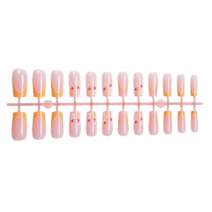 Floral print press-on nails with orange French tips and daisy designs on a 24-piece set