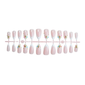 Classic French tip almond press-on nails in pink with gold star and colorful beads