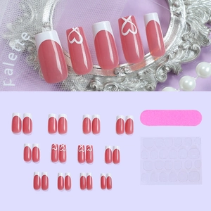 Pink heart pattern press-on nails set with 24 pieces, mini file and glue stickers