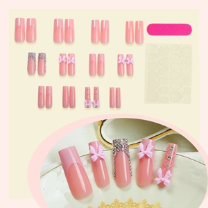 Pink press-on nail set with 3D bows and rhinestones including nail file and glue tabs