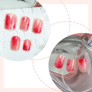 Short round red gradient blush press-on nails set with marbled artistic design