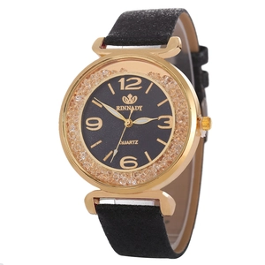 Dettaglio del quadrante dell'orologio al quarzo dorato con lunetta interna brillante