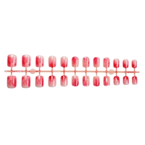 Short square round press-on nails with red pink gradient and splatter pattern