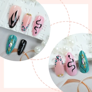 Cool hand-painted long press-on nails with snake and flame patterns and rhinestones