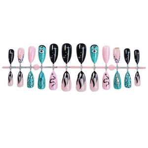 Cool graffiti long press-on nails featuring evil eye, fire, and leopard print patterns