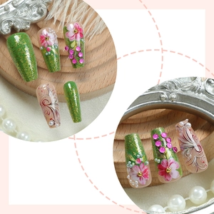 Floral press-on nails with green glitter, pink flowers and pearls in long coffin shape