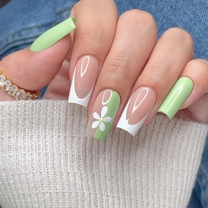 Floral press-on nails in mint green and nude with white daisy motifs and long square tips