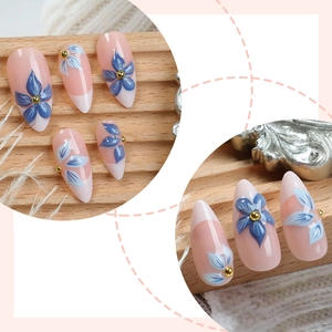 French 3D blue floral almond press-on nails with nude pink base and golden beads