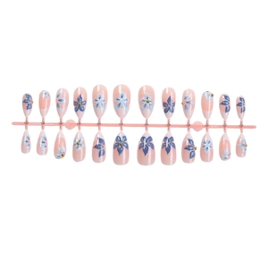 French almond press-on nails featuring 3D blue flowers and pink floral patterns