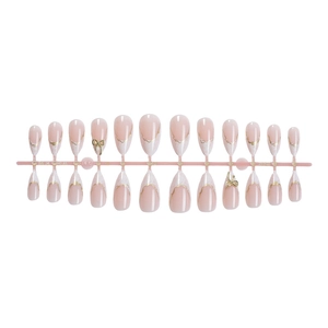 Faux ongles amande rose nude avec bords dorés et nœuds 3D de style français chic