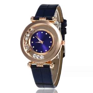 Women's rose gold quartz watch with blue leather strap and floating rhinestones