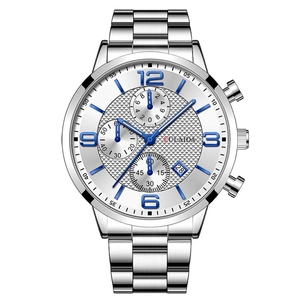 Macro view of men's steel business watch dial with blue luminous hands and date window