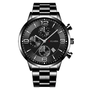 Macro detail of men's chronograph watch with textured dial and steel band link