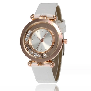 Women's rose gold watch with floating rhinestones and white leather strap on white background