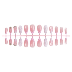 Pink gradient press-on nails with silver glitter hearts and rhinestones on white base
